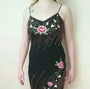 Cache 100% silk size 10. Hand beaded.
